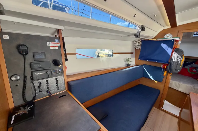 Slide: The Image of Interior of 2019 Jeanneau Sun Odyssey 349 sailboat with navigation panel and seating area. - 22
