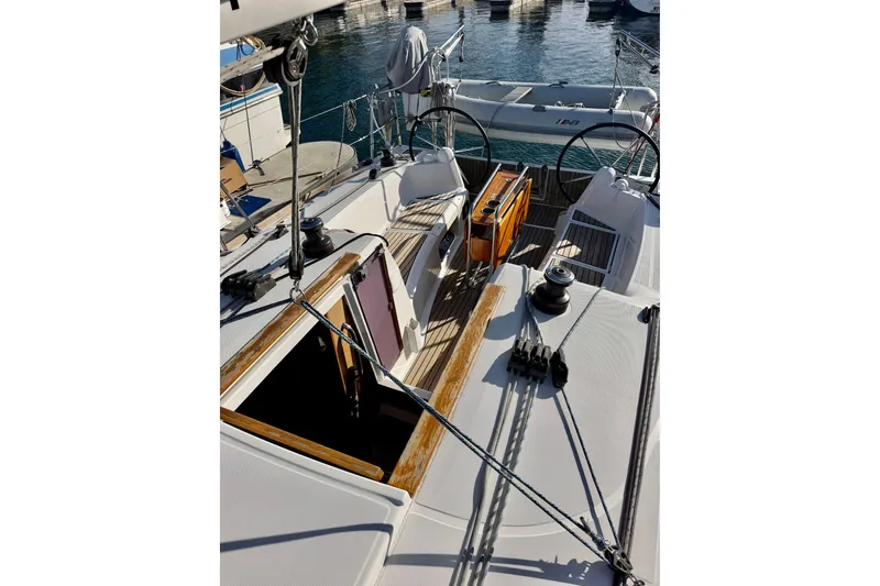 Slide: The Image of Cockpit view of 2019 Jeanneau Sun Odyssey 349 sailboat docked at marina. - 18
