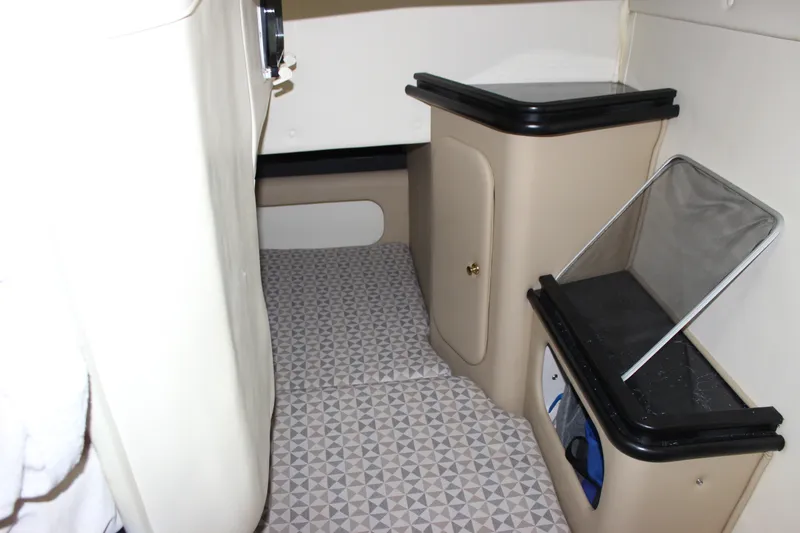 Slide: The Image of Interior cabin of 2006 Rinker 290 Express Cruiser with storage compartments. - 26