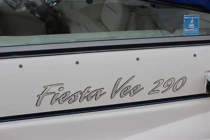 Slide: The Image of 2006 Rinker 290 Express Cruiser, Fiesta Vee 290 branding on boat exterior. - 12