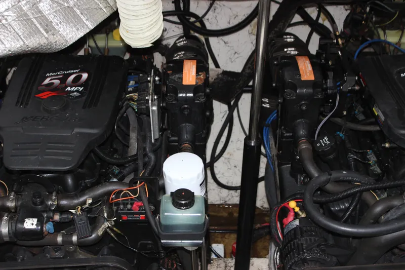 Slide: The Image of Engine compartment of a 2006 Rinker 290 Express Cruiser with MerCruiser 5.0 MPI engines. - 30