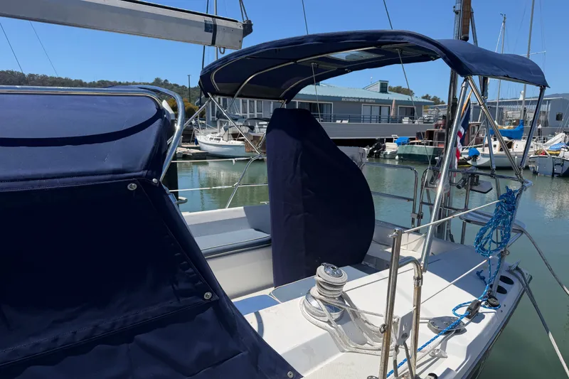 Slide: The Image of 1996 Catalina 36 MkII sailboat cockpit with blue canvas covers in marina setting. - 28
