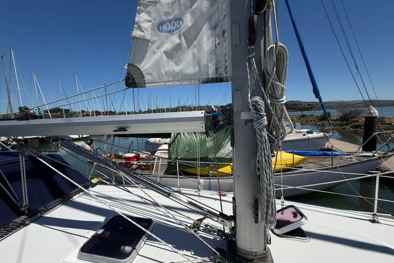 Slide: The Image of 1996 Catalina 36 MkII sailboat docked, featuring mast and rigging details. - 15