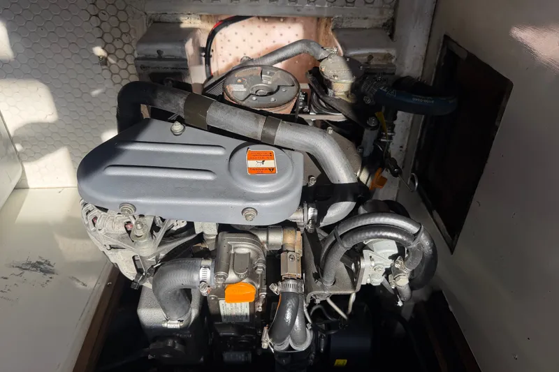 Slide: The Image of Engine compartment of a 1996 Catalina 36 MkII sailboat, showcasing mechanical components. - 50