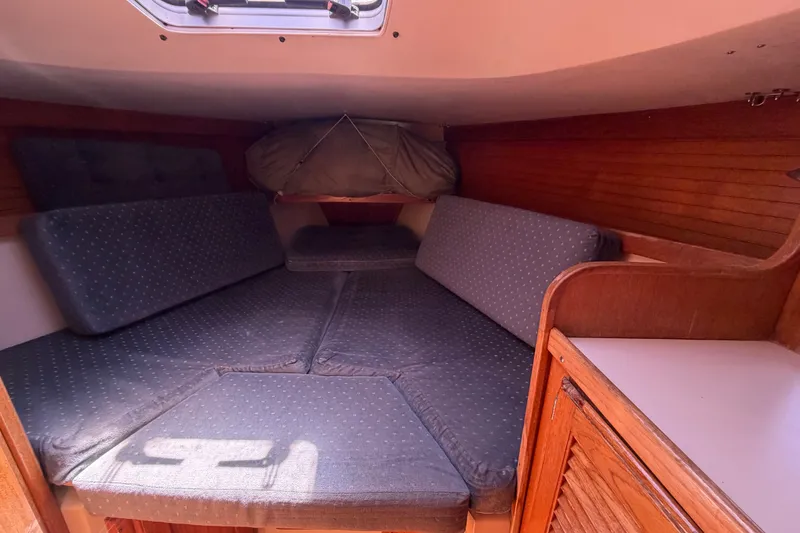 Slide: The Image of Cozy cabin interior of a 1996 Catalina 36 MkII sailboat with cushioned seating. - 44