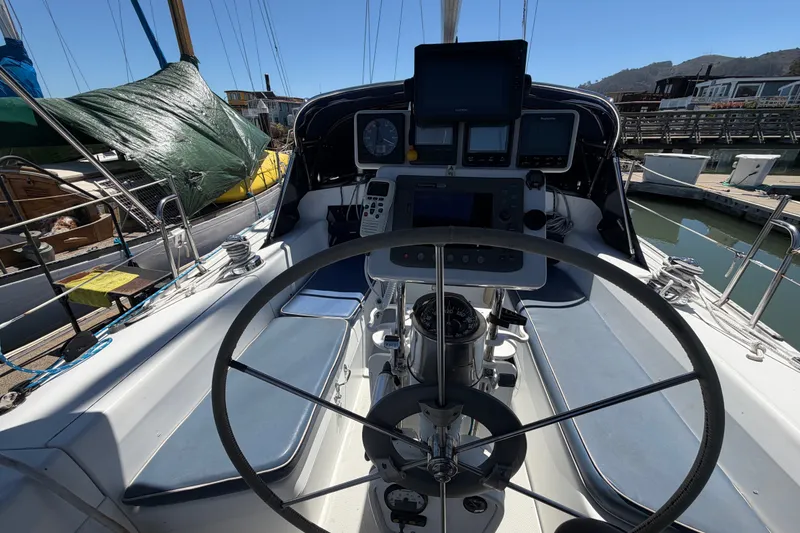 Slide: The Image of Cockpit of a 1996 Catalina 36 MkII sailboat with navigation instruments and steering wheel. - 30