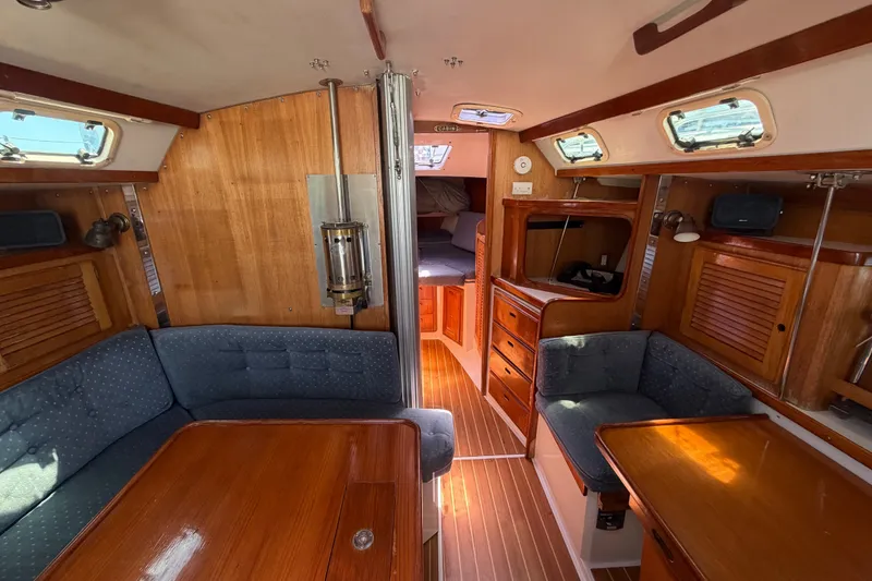 Slide: The Image of Interior of a 1996 Catalina 36 MkII sailboat with wood finish and seating area. - 40
