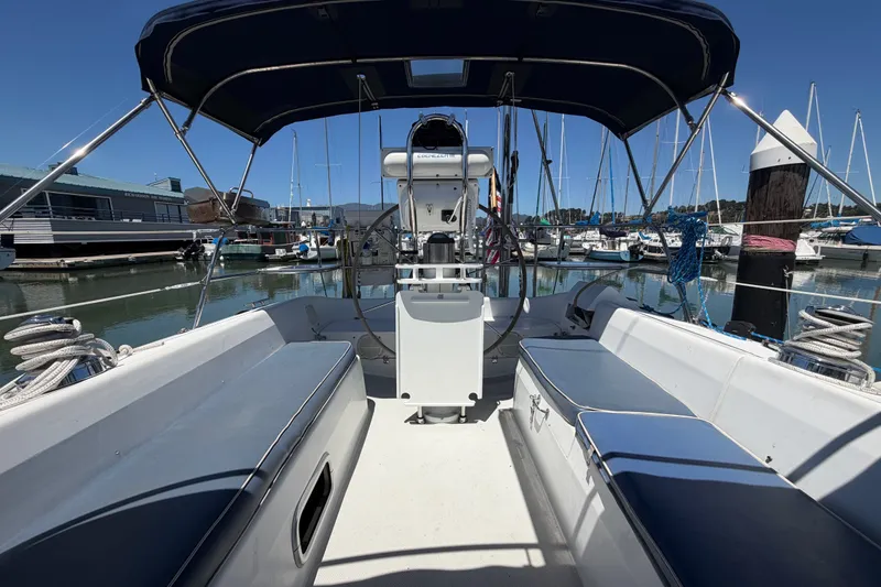 Slide: The Image of 1996 Catalina 36 MkII sailboat cockpit with blue canopy, docked in marina. - 26