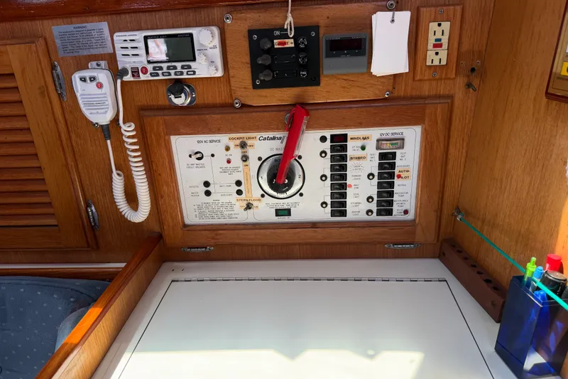 Slide: The Image of Control panel of a 1996 Catalina 36 MkII sailboat, featuring navigation and electrical systems. - 47