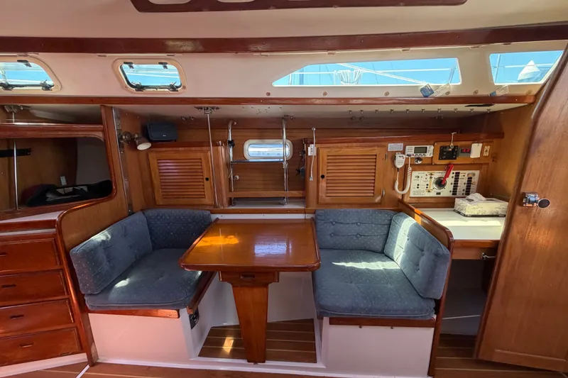 Slide: The Image of Interior of 1996 Catalina 36 MkII sailboat with cozy seating and wooden cabinetry. - 41