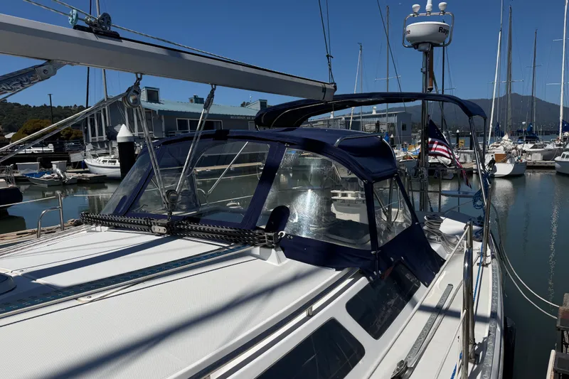 Slide: The Image of 1996 Catalina 36 MkII sailboat docked in a marina under clear blue skies. - 21