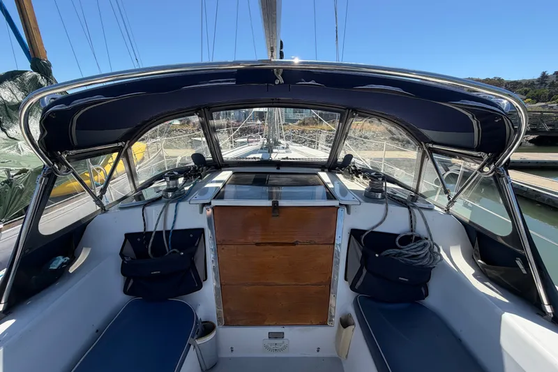 Slide: The Image of Cockpit of a 1996 Catalina 36 MkII sailboat with blue canopy and seating. - 25