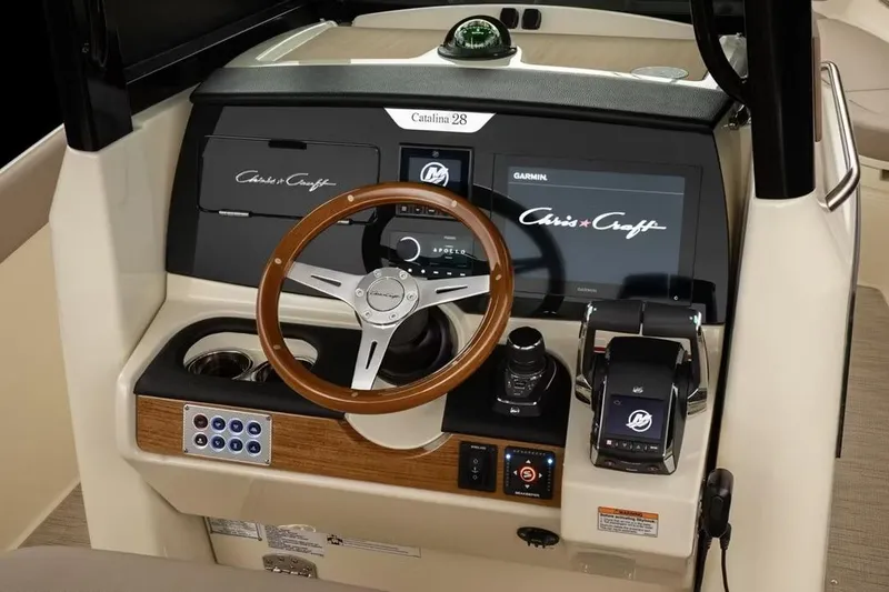 Slide: The Image of Manufacturer Provided Image: 2026 Chris-Craft Catalina 28 helm with modern controls and wooden steering wheel. - 4