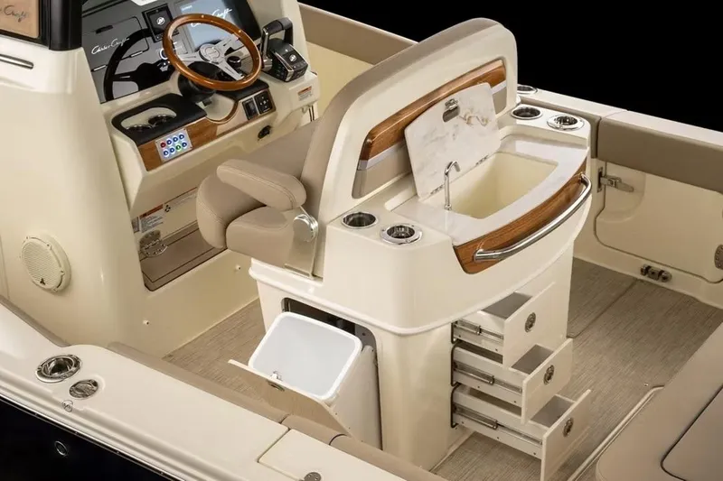 Slide: The Image of Manufacturer Provided Image: 2026 Chris-Craft Catalina 28 interior with helm, sink, and storage drawers. - 8