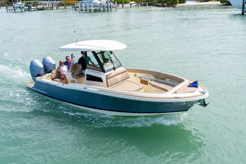 The Image of 2026 Chris-Craft Catalina 28 cruising on clear waters with passengers onboard. - 1