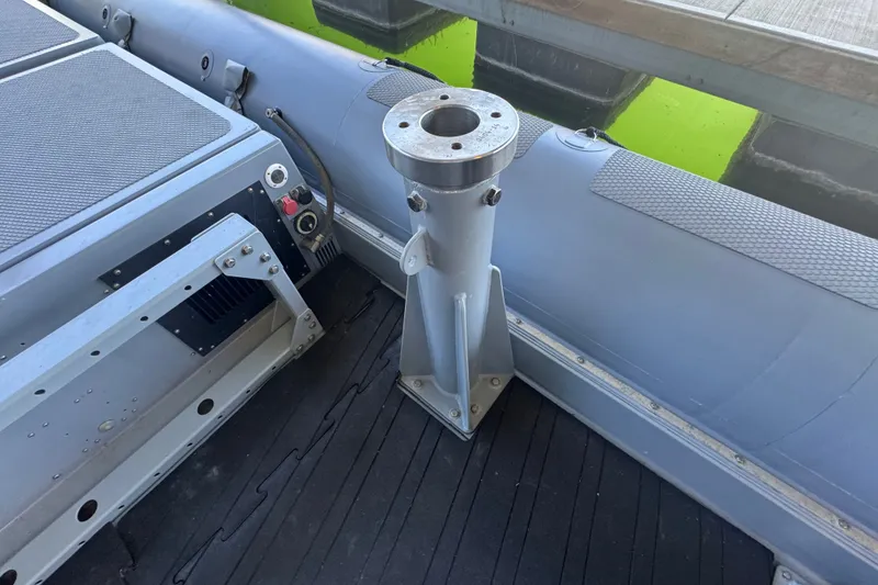 Slide: The Image of 2004 Zodiac Milpro Hurricane boat interior with metal mount and control panel. - 33