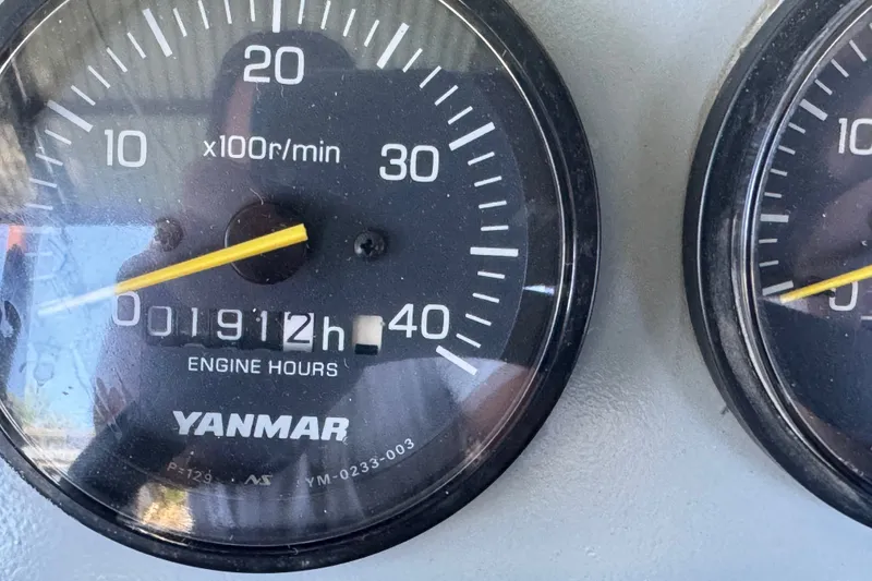 Slide: The Image of Close-up of Yanmar engine hour meter showing 1912 hours on Zodiac Milpro Hurricane 2004. - 22
