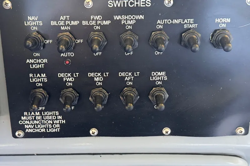 Slide: The Image of Control panel with switches for Zodiac Milpro Hurricane 2004 boat functions. - 18