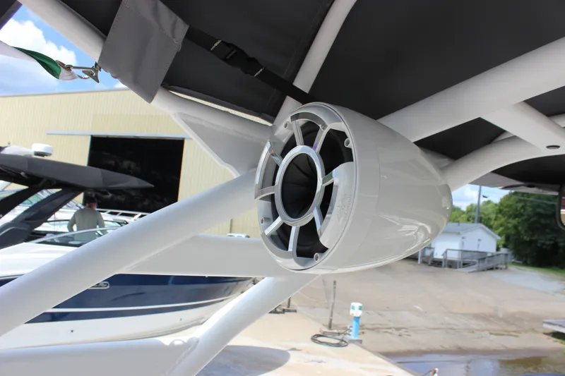Slide: The Image of 2022 Yamaha Boats 252XE speaker detail under canopy, showcasing sleek design and craftsmanship. - 15