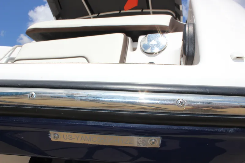 Slide: The Image of 2022 Yamaha Boats 252XE, close-up of rear deck and identification plate. - 17