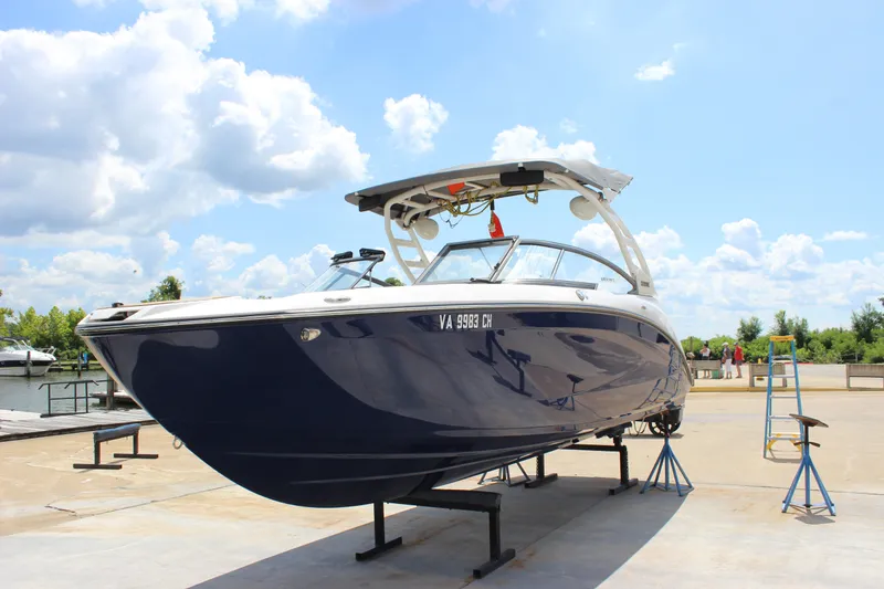 Slide: The Image of 2022 Yamaha Boats 252XE on a stand under a bright blue sky. - 27