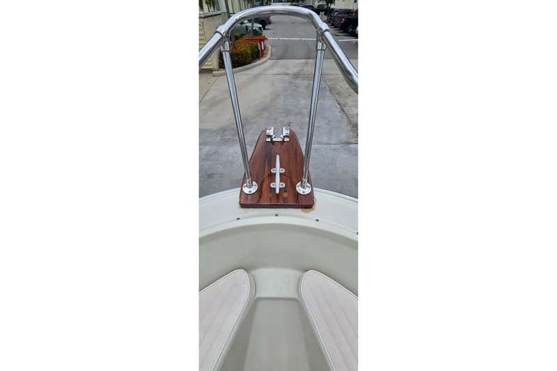 Slide: The Image of 1986 Boston Whaler Outrage 20 bow with stainless steel railings and wooden deck. - 15