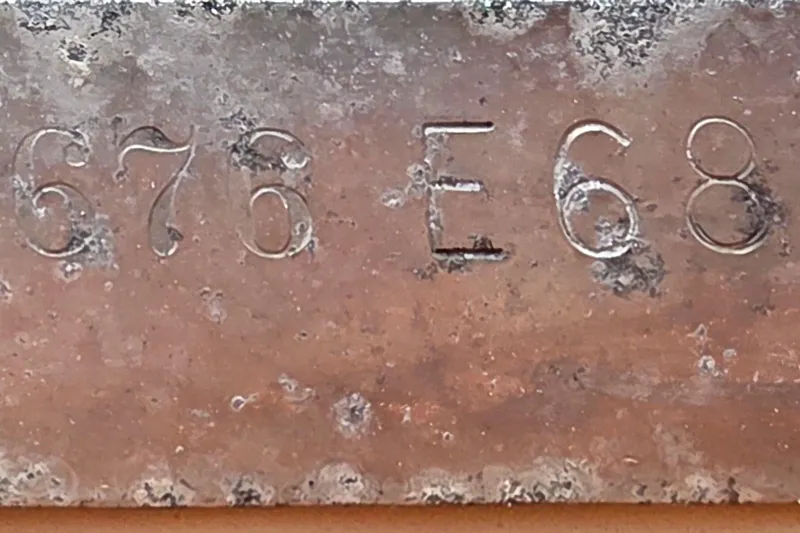 Slide: The Image of Rusty metal plate with engraved numbers '676 E68', Boston Whaler Outrage 20, 1986. - 25
