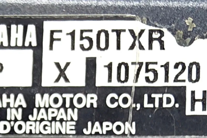 Slide: The Image of Label of Yamaha F150TXR engine on 1986 Boston Whaler Outrage 20 boat. - 24