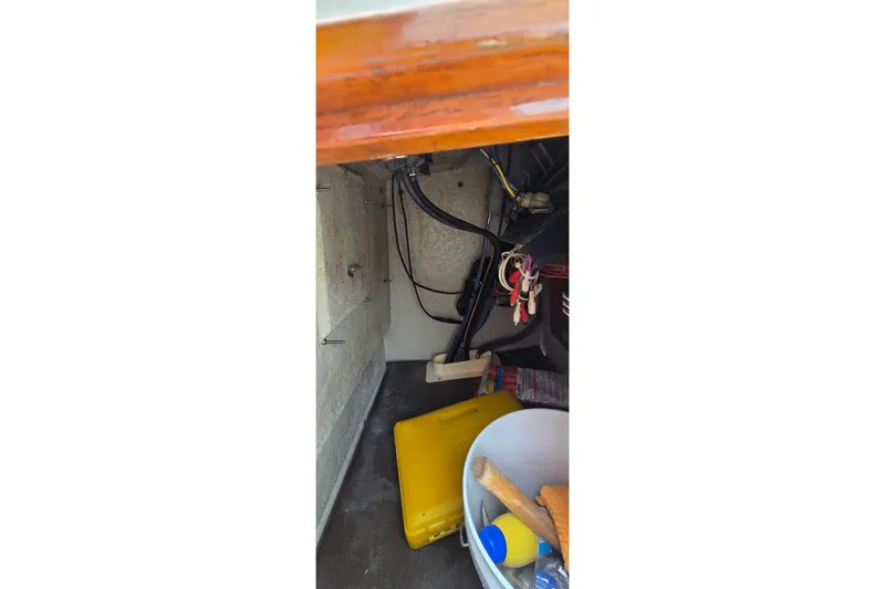 Slide: The Image of Interior view of a 1986 Boston Whaler Outrage 20 boat showing storage compartment. - 20