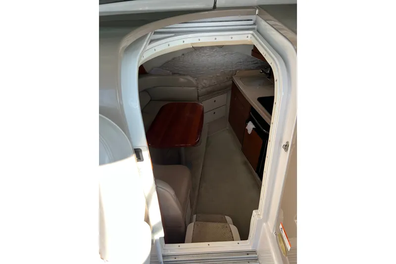 Slide: The Image of Interior view of 2003 Four Winns 298 Vista cabin with seating and kitchenette. - 15