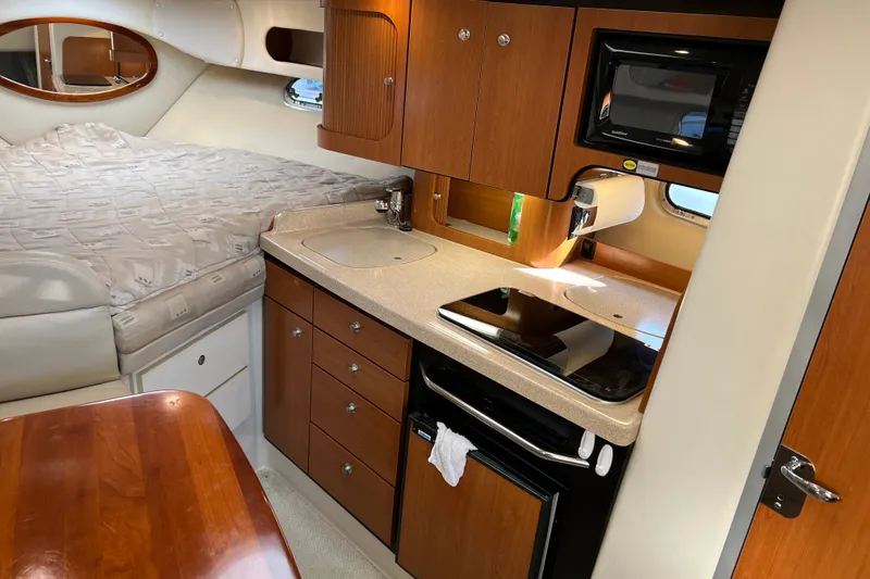 Slide: The Image of Interior of 2003 Four Winns 298 Vista boat with kitchenette and bed. - 20