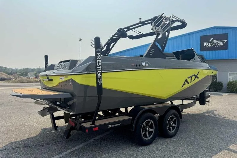 Slide: The Image of 2022 ATX Surf Boats 20 Type-S on trailer, parked outside Prestige dealership. - 9