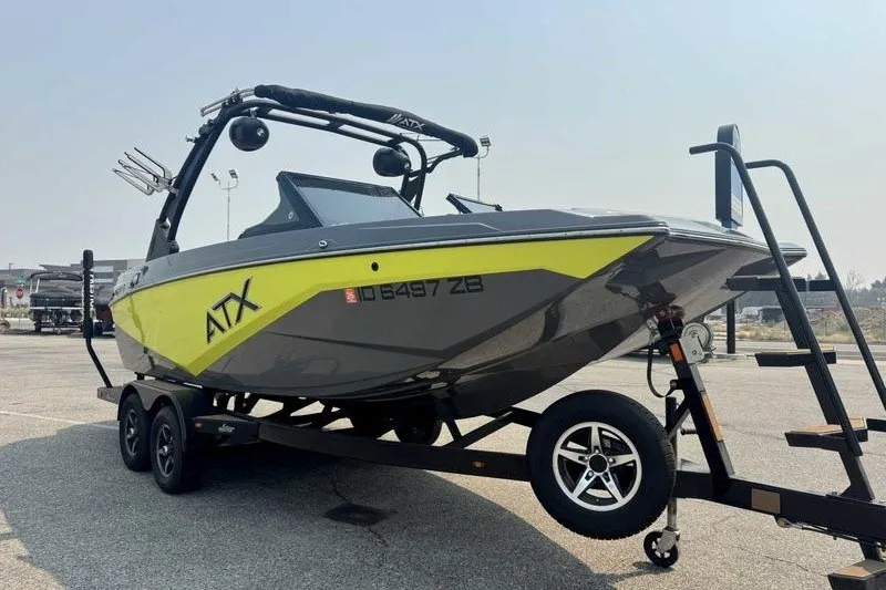 Slide: The Image of 2022 ATX Surf Boats 20 Type-S on trailer, featuring sleek design and vibrant yellow accents. - 5