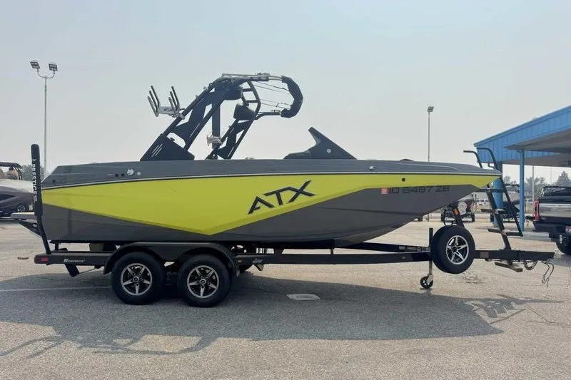 Slide: The Image of 2022 ATX Surf Boats 20 Type-S in parking lot, vibrant yellow and gray design. - 10