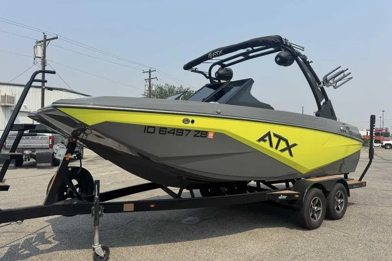 Slide: The Image of 2022 ATX Surf Boats 20 Type-S in vibrant yellow and gray on trailer. - 4