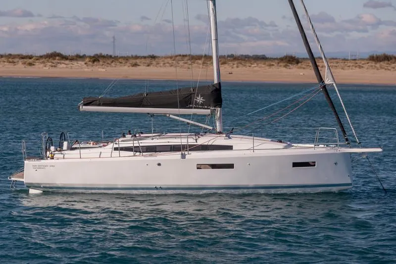 The Image of Manufacturer Provided Image: 2026 Jeanneau Sun Odyssey 380 sailboat on calm water near a sandy shore. - 0