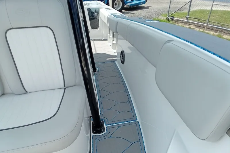 Slide: The Image of 2022 Sea Fox 228 Commander interior with white seating and patterned flooring. - 17
