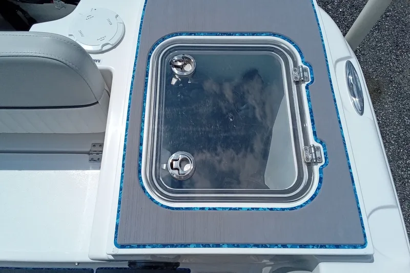Slide: The Image of 2022 Sea Fox 228 Commander boat with a sleek, modern livewell design. - 3