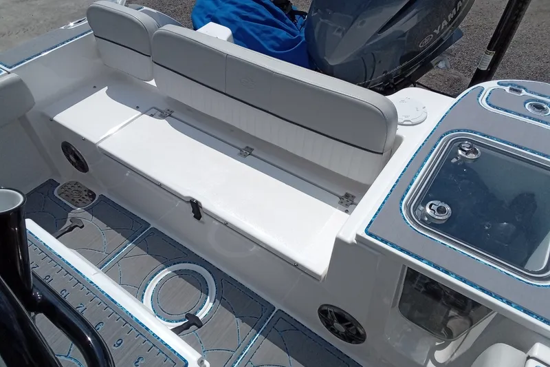 Slide: The Image of 2022 Sea Fox 228 Commander boat interior with seating and storage compartments. - 2