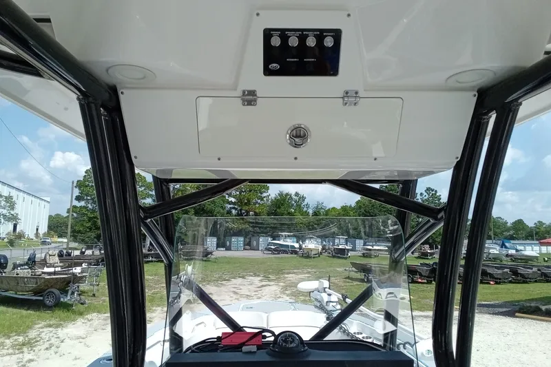 Slide: The Image of 2022 Sea Fox 228 Commander boat interior with control panel and windshield view. - 7