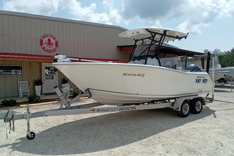 Slide: The Image of 2022 Sea Fox 228 Commander boat on trailer outside a marine shop. - 39