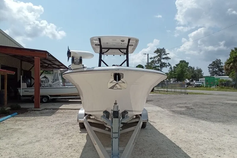 Slide: The Image of 2022 Sea Fox 228 Commander boat on trailer, parked outdoors under cloudy sky. - 40