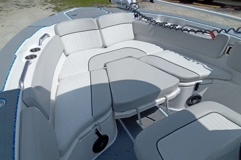 Slide: The Image of 2022 Sea Fox 228 Commander boat interior with cushioned seating and cup holders. - 23