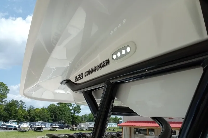 Slide: The Image of 2022 Sea Fox 228 Commander boat detail with logo and canopy structure. - 35