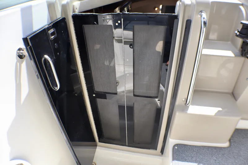 Slide: The Image of Open cabin door of 2010 Sea Ray Sundancer 260 boat, showing interior steps. - 25