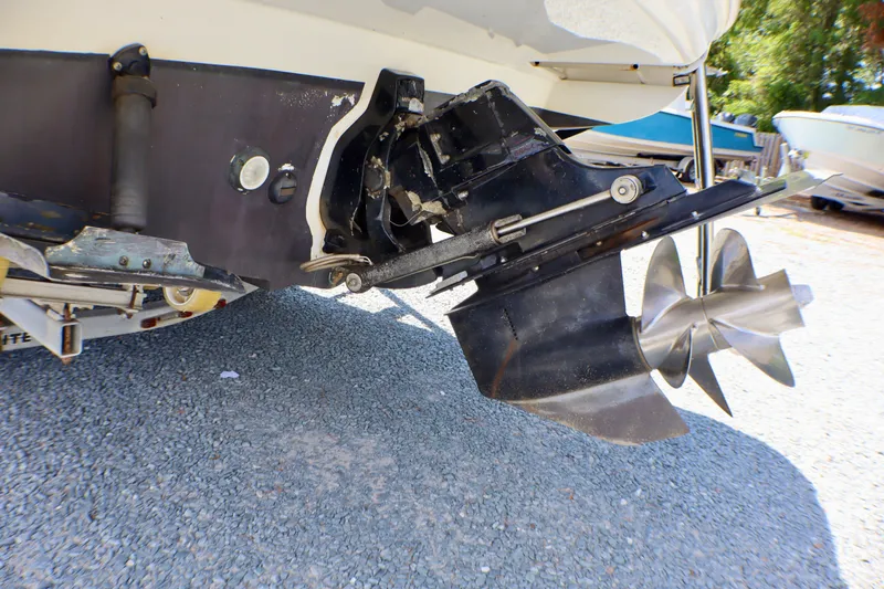 Slide: The Image of 2010 Sea Ray Sundancer 260 boat stern drive and propeller on gravel surface. - 51