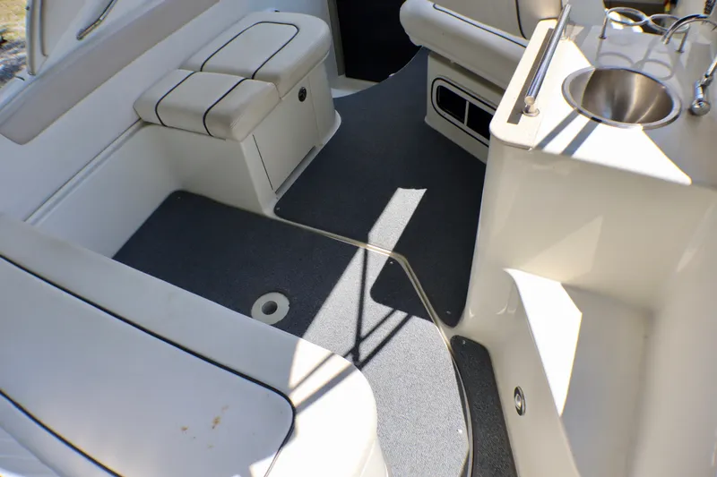 Slide: The Image of Interior of 2010 Sea Ray Sundancer 260 boat with seating and sink area. - 56