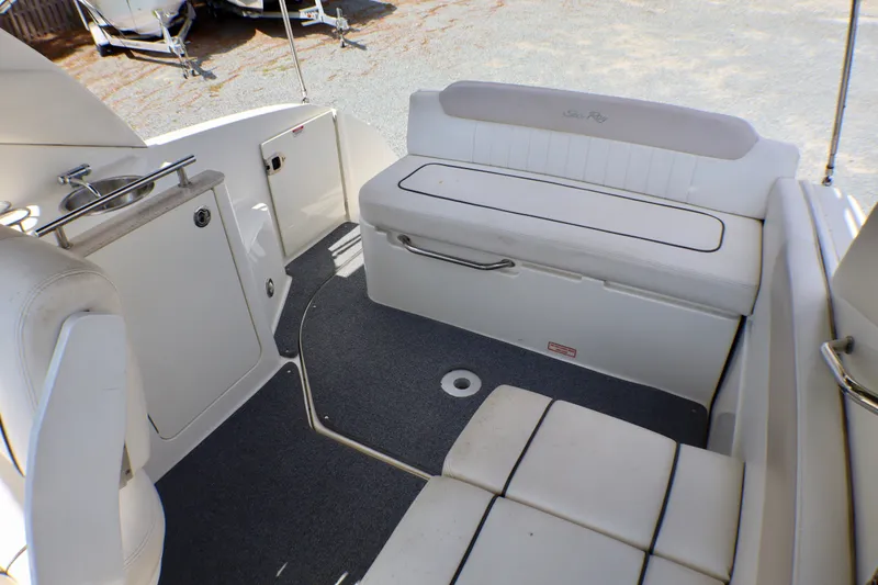 Slide: The Image of Interior of 2010 Sea Ray Sundancer 260 boat with seating and kitchenette area. - 10