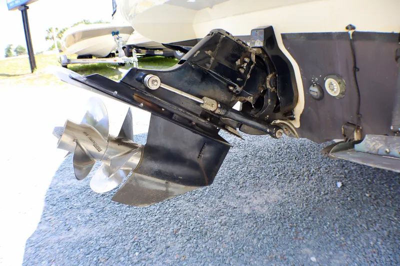 Slide: The Image of Close-up of 2010 Sea Ray Sundancer 260 boat propeller and stern drive on gravel. - 52