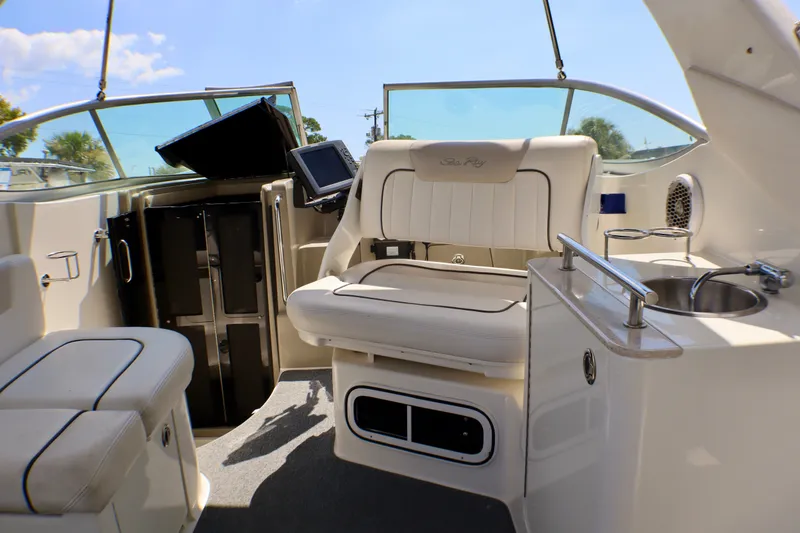 Slide: The Image of Interior of 2010 Sea Ray Sundancer 260 boat with seating and helm. - 28